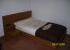 cabezal,mesita de noche y cama en chapa de zebrano,la cama contiene ruedas para un facil manejo .