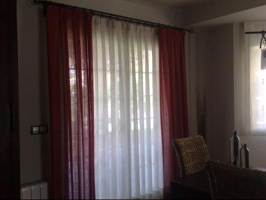 cortinas de lino con barras de forja