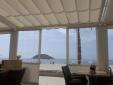 Toldo deslizante con verticales transparentes