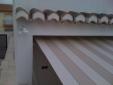 Toldo extensible motorizado con veleta.