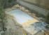 Construcción piscina entorno rocas