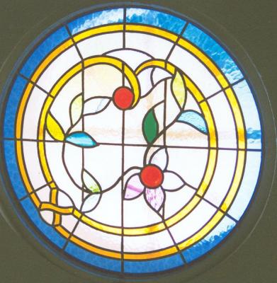 Ojo de buey floral vidriera