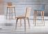 Silla de comedor de diseño con respaldo en tablero contrachapado curvado en diferentes acabados. Patas en madera de haya.